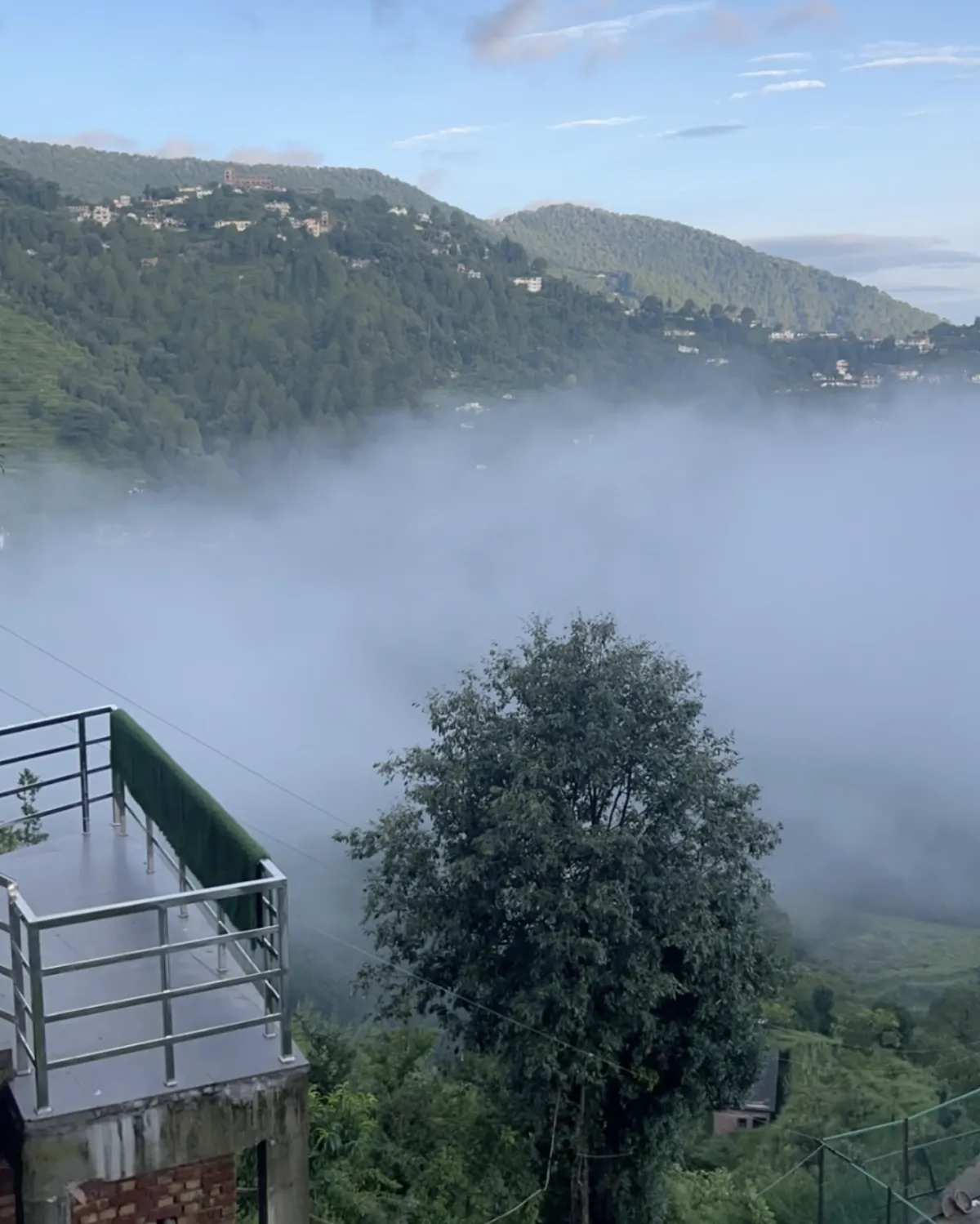 Clouds coming over the terrace railing, Hotel Cloud Inn, Ramgarh, Nainital