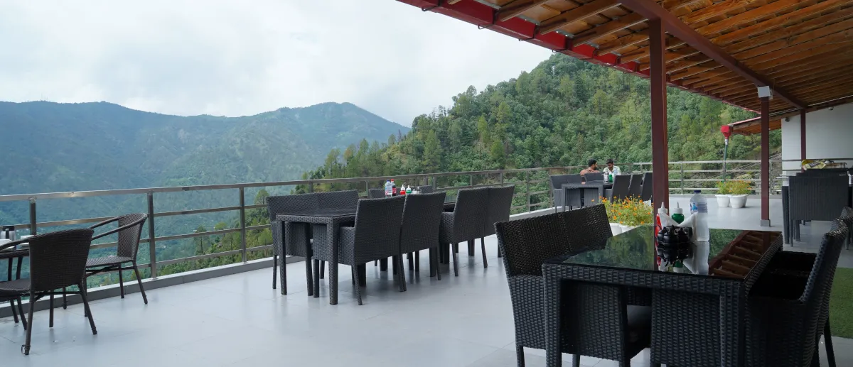 Open rooftop terrace, tables set, Hotel Cloud Inn, Ramgarh, Nainital